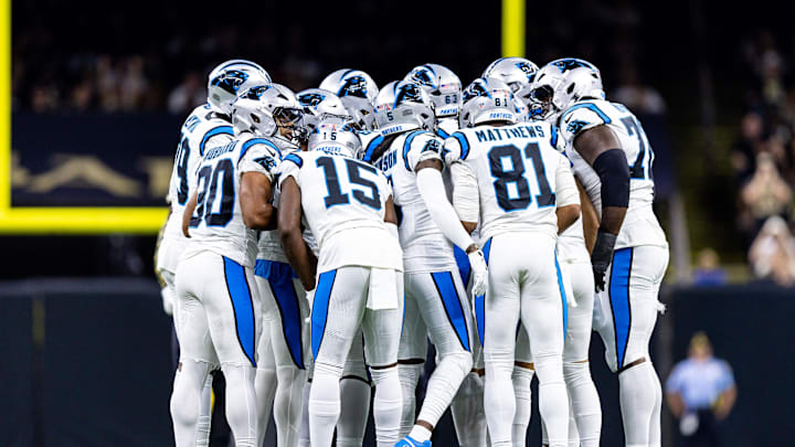 Sep 8, 2024; New Orleans, Louisiana, USA;  Carolina Panthers quarterback Bryce Young (9) calls a play in the huddle with wide receiver Jonathan Mingo (15) against the New Orleans Saints during the first half at Caesars Superdome. Mandatory Credit: Stephen Lew-Imagn Images