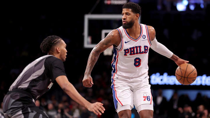 Feb 12, 2025; Brooklyn, New York, USA; Philadelphia 76ers forward Paul George (8) controls the ball against Brooklyn Nets forward Ziaire Williams (8) during the third quarter at Barclays Center. Mandatory Credit: Brad Penner-Imagn Images