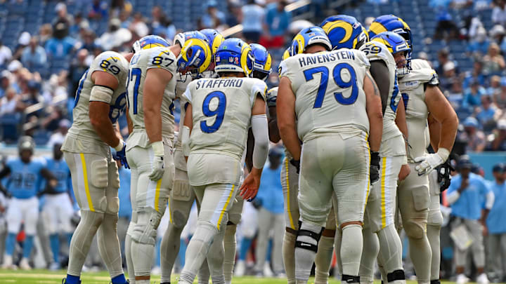 Sep 14, 2025; Nashville, Tennessee, USA;  Los Angeles Rams quarterback Matthew Stafford (9) calls the play in the huddle against the Tennessee Titans during the second half at Nissan Stadium. Mandatory Credit: Steve Roberts-Imagn Images