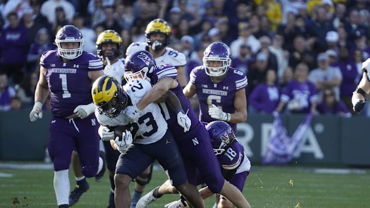 Nov 15, 2025; Chicago, Illinois, USA; Michigan Wolverines running back Jordan Marshall (23) runs against the Northwestern Wildcats during the second half at Wrigley Field. Mandatory Credit: David Banks-Imagn Images
