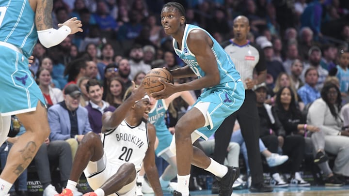 Oct 22, 2025; Charlotte, North Carolina, USA;  Charlotte Hornets center Moussa Diabate (14) steals the ball from Brooklyn Nets center Day’Ron Sharpe (20) during the first half at the Spectrum Center. Mandatory Credit: Sam Sharpe-Imagn Images