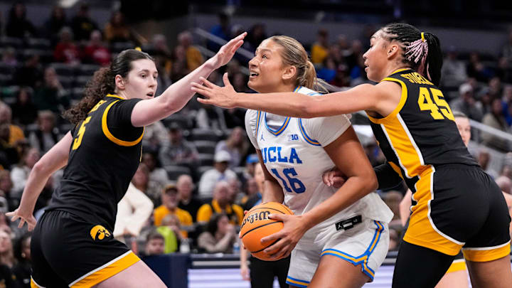 UCLA Bruins forward Sienna Betts (16) rushes up the the paint against Iowa Hawkeyes forward Hannah Stuelke (45) and Iowa Hawkeyes center Ava Heiden (5) on Sunday, March 8, 2026, during the Big Ten Tournament Championship game at Gainbridge Fieldhouse in Indianapolis.