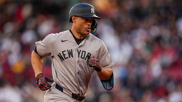 New York Yankees designated hitter Giancarlo Stanton (27) rounds the bases after hitting a home run against the Boston Red Sox in the second inning at Fenway Park.