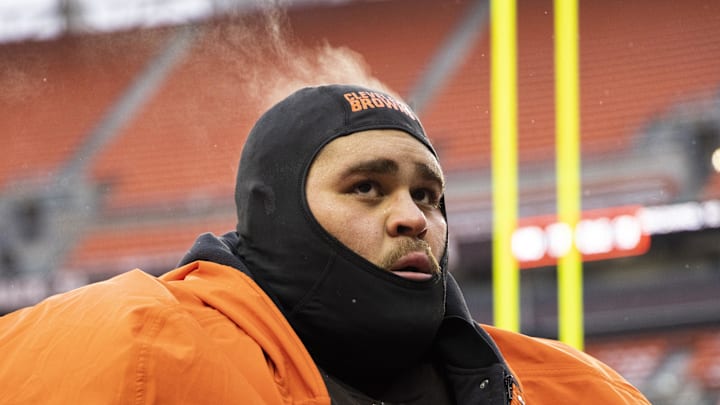 Dec 24, 2022; Cleveland, Ohio, USA; Steam comes off the head of Cleveland Browns offensive tackle Jedrick Wills Jr. (71) as he walks off the field following the game against the New Orleans Saints at FirstEnergy Stadium. Mandatory Credit: Scott Galvin-Imagn Images