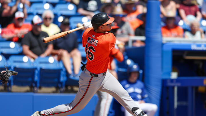 Baltimore Orioles third baseman Coby Mayo (16) doubles against the Toronto Blue Jays in the second inning during spring training at TD Ballpark on March 13.