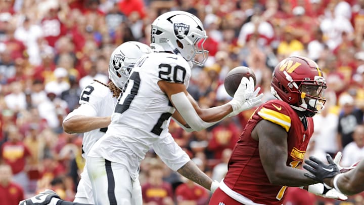 Sep 21, 2025; Landover, Maryland, USA; Washington Commanders wide receiver Deebo Samuel Sr. (1) is unable to make a catch during the first half against Las Vegas Raiders cornerback Eric Stokes (22) at Northwest Stadium. Mandatory Credit: Amber Searls-Imagn Images