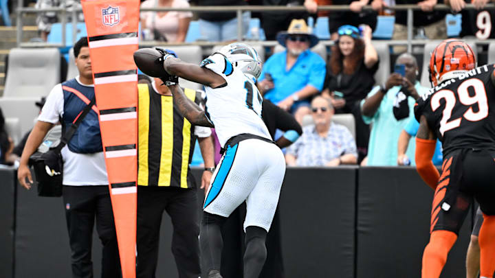 Sep 29, 2024; Charlotte, North Carolina, USA; Carolina Panthers wide receiver Xavier Legette (17) makes catch as Cincinnati Bengals cornerback Cam Taylor-Britt (29) pressures in the first quarter at Bank of America Stadium. Mandatory Credit: Bob Donnan-Imagn Images Sep 29, 2024; Charlotte, North Carolina, USA; Carolina Panthers wide receiver Xavier Legette (17) makes catch as Cincinnati Bengals cornerback Cam Taylor-Britt (29) pressures in the first quarter at Bank of America Stadium. Mandatory Credit: Bob Donnan-Imagn Images