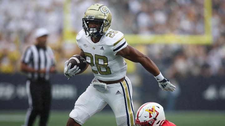Sep 14, 2024; Atlanta, Georgia, USA; Georgia Tech Yellow Jackets running back Trelain Maddox (28) is tackled by Virginia Military Institute Keydets defensive back Shamus Jones (2) in the second quarter at Bobby Dodd Stadium at Hyundai Field. Mandatory Credit: Brett Davis-Imagn Images