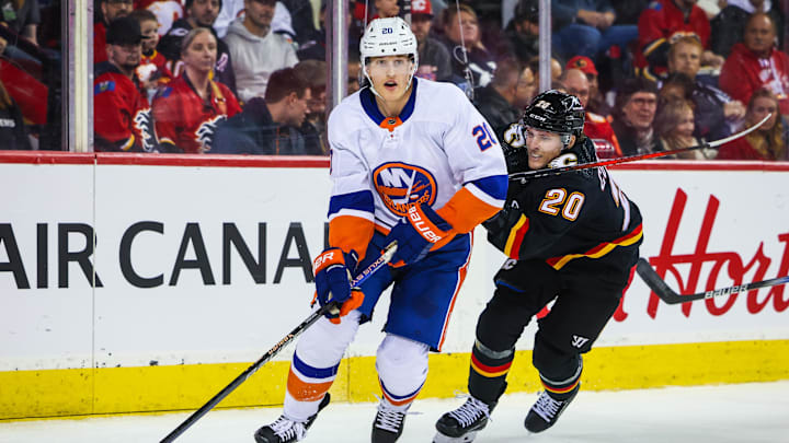 Nov 18, 2023; Calgary, Alberta, CAN; New York Islanders right wing Hudson Fasching (20) and Calgary