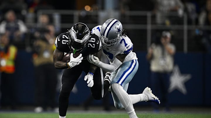 Dec 24, 2022; Arlington, Texas, USA; Philadelphia Eagles running back Miles Sanders (26) and Dallas Cowboys cornerback Trevon Diggs (7) in action during the game between the Dallas Cowboys and the Philadelphia Eagles at AT&T Stadium. Mandatory Credit: Jerome Miron-Imagn Images