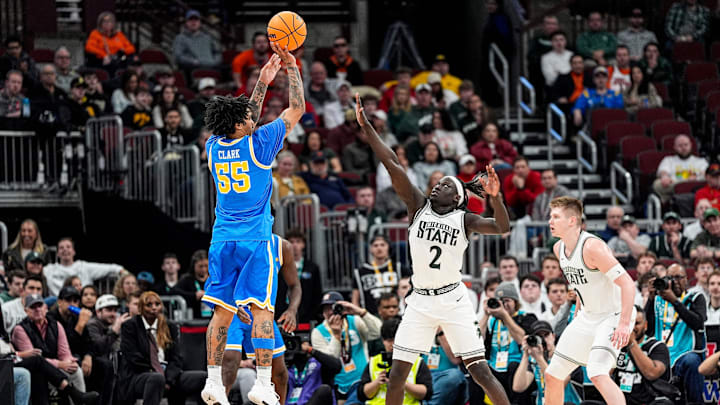 UCLA guard Skyy Clark (55) shoots a 3-pointer against Michigan State guard Kur Teng (2) during the first half of Big Ten tournament quarterfinal at United Center in Chicago on Friday, March 13, 2026.