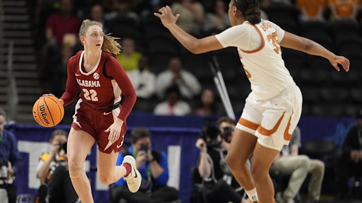 Mar 6, 2026; Greenville, SC, USA; Alabama Crimson Tide guard Karly Weathers (22) brings the ball up court against Texas Longhorns forward Madison Booker (35) during the first half at Bon Secours Wellness Arena. Mandatory Credit: Jim Dedmon-Imagn Images