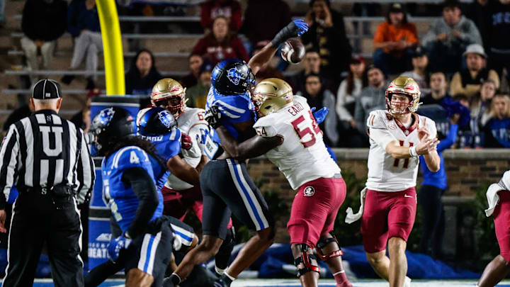 Oct 18, 2024; Durham, North Carolina, USA;  Duke Blue Devils defensive end Vincent Anthony Jr. (7) blocks Florida State Seminoles quarterback Brock Glenn (11) throw during the first half of the game at Wallace Wade Stadium. Mandatory Credit: Jaylynn Nash-Imagn Images