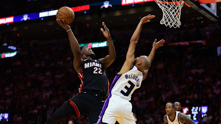 Nov 4, 2024; Miami, Florida, USA; Miami Heat forward Jimmy Butler (22) drives to the basket against Sacramento Kings guard Jordan McLaughlin (3) during the second quarter at Kaseya Center. Mandatory Credit: Sam Navarro-Imagn Images