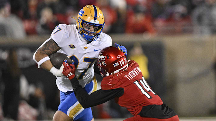 Nov 23, 2024; Louisville, Kentucky, USA;  Pittsburgh Panthers tight end Jake Overman (87) runs against Louisville Cardinals defensive back Corey Thornton (14) during the second half at L&N Federal Credit Union Stadium. Louisville defeated Pittsburgh 37-9. Mandatory Credit: Jamie Rhodes-Imagn Images
