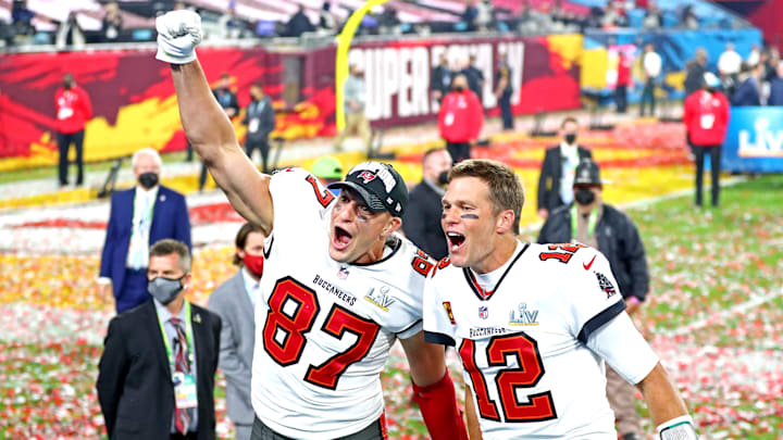 Feb 7, 2021; Tampa, FL, USA;  Tampa Bay Buccaneers quarterback Tom Brady (12) and tight end Rob Gronkowski (87) celebrate after beating the Kansas City Chiefs in Super Bowl LV at Raymond James Stadium.  Mandatory Credit: Mark J. Rebilas-Imagn Images