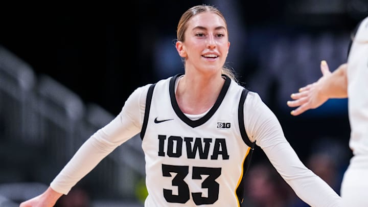 Iowa Hawkeyes guard Lucy Olsen (33) smiles after scoring Wednesday, March 5, 2025, in a round one game at the 2025 TIAA Big Ten Women's Basketball Tournament between the Iowa Hawkeyes and the Wisconsin Badgers at Gainbridge Fieldhouse in Indianapolis.