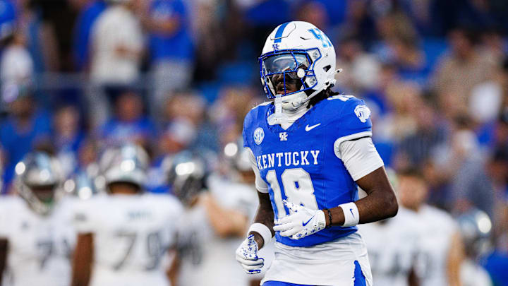 Sep 13, 2025; Lexington, Kentucky, USA; Kentucky Wildcats defensive back Cam Dooley (18) runs onto the field before the game against the Eastern Michigan Eagles at Kroger Field. Mandatory Credit: Jordan Prather-Imagn Images