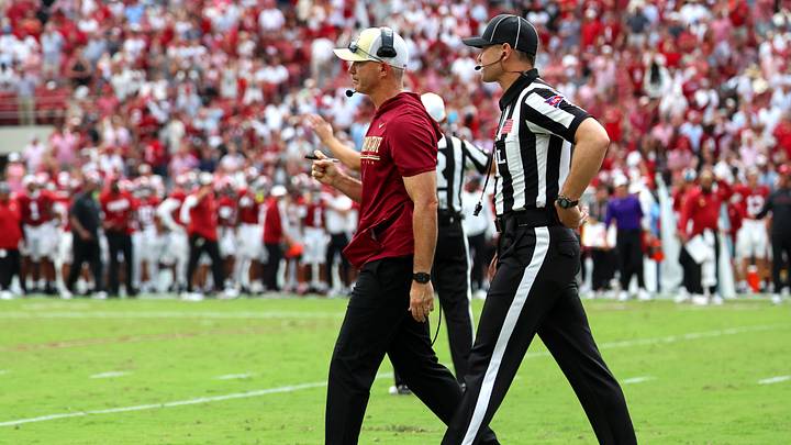 Sep 19, 2026; Tuscaloosa, Alabama, USA; Florida State Seminoles head coach Mike Norvell walks off with an official during the second quarter against the Alabama Crimson Tide at Saban Field at Bryant-Denny Stadium. Mandatory Credit: David Leong-Imagn Images