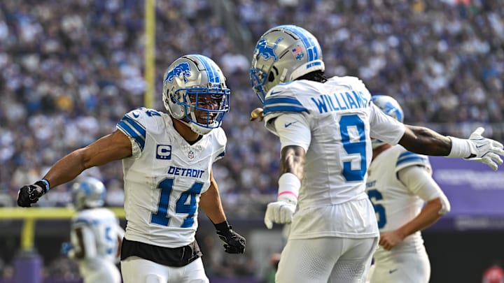 Oct 20, 2024; Minneapolis, Minnesota, USA; Detroit Lions wide receiver Amon-Ra St. Brown (14) reacts with wide receiver Jameson Williams (9) after catching a 35 yard touchdown pass from quarterback Jared Goff (not pictured) against the Minnesota Vikings the second quarter at U.S. Bank Stadium. Mandatory Credit: Jeffrey Becker-Imagn Images