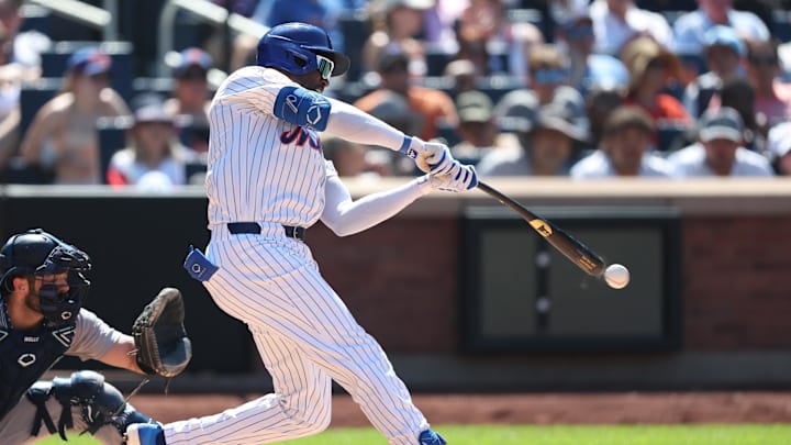 Jul 6, 2025; New York City, New York, USA; New York Mets third baseman Ronny Mauricio (10) singles during the eighth inning against the New York Yankees at Citi Field. Mandatory Credit: Vincent Carchietta-Imagn Images
