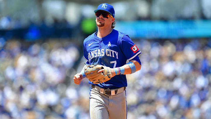 Jun 16, 2024; Los Angeles, California, USA; Kansas City Royals shortstop Bobby Witt Jr. (7) returns to the dugout following the fourth inning against the Los Angeles Dodgers at Dodger Stadium. Mandatory Credit: Gary A. Vasquez-USA TODAY Sports