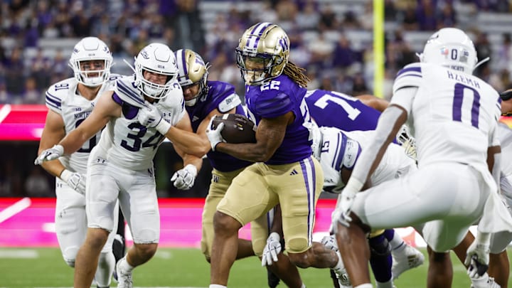 Sep 21, 2024; Seattle, Washington, USA; Washington Huskies running back Cameron Davis (22) rushes against the Northwestern Wildcats during the fourth quarter at Alaska Airlines Field at Husky Stadium. Mandatory Credit: Joe Nicholson-Imagn Images