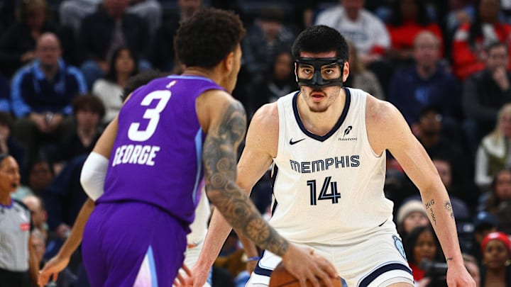 Jan 25, 2025; Memphis, Tennessee, USA; Memphis Grizzlies center Zach Edey (14) looks on as Utah Jazz guard Keyonte George (3) brings the ball downcourt during the first quarter at FedExForum. Mandatory Credit: Petre Thomas-Imagn Images Jan 25, 2025; Memphis, Tennessee, USA; Memphis Grizzlies center Zach Edey (14) looks on as Utah Jazz guard Keyonte George (3) brings the ball downcourt during the first quarter at FedExForum. Mandatory Credit: Petre Thomas-Imagn Images