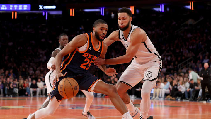 Nov 15, 2024; New York, New York, USA; New York Knicks forward Mikal Bridges (25) drives to the basket against Brooklyn Nets guard Ben Simmons (10) during the fourth quarter at Madison Square Garden. Mandatory Credit: Brad Penner-Imagn Images