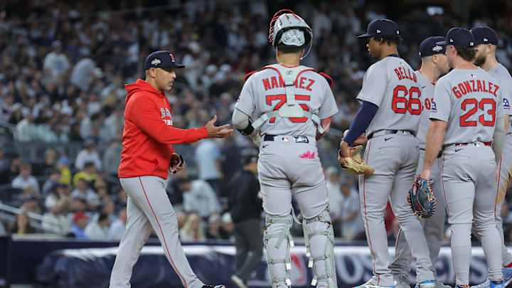 Oct 1, 2025; Bronx, New York, USA; Boston Red Sox manager Alex Cora (13) makes a pitching change during the third inning against the New York Yankees during game two of the Wildcard round for the 2025 MLB playoffs at Yankee Stadium. Mandatory Credit: Brad Penner-Imagn Images Oct 1, 2025; Bronx, New York, USA; Boston Red Sox manager Alex Cora (13) makes a pitching change during the third inning against the New York Yankees during game two of the Wildcard round for the 2025 MLB playoffs at Yankee Stadium. Mandatory Credit: Brad Penner-Imagn Images