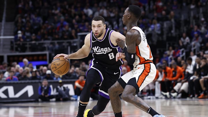 Apr 7, 2025; Detroit, Michigan, USA;  Sacramento Kings guard Zach LaVine (8) dribbles defended by Detroit Pistons guard Dennis Schroder (17) in the first half at Little Caesars Arena. Mandatory Credit: Rick Osentoski-Imagn Images