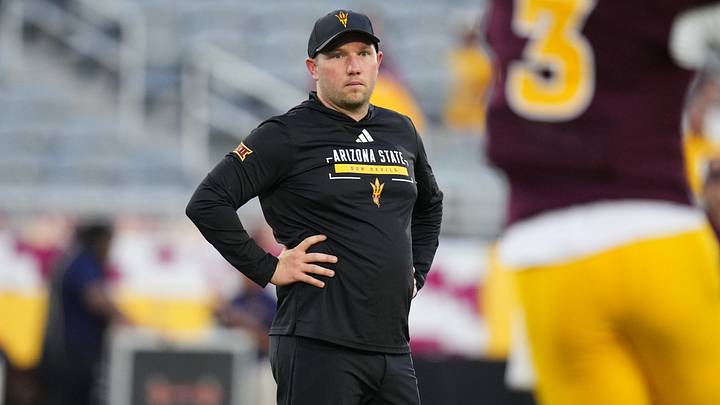 Arizona State head coach Kenny Dillingham watches his players warm up before their game against the Morgan State Bears at Mountain America Stadium in Tempe on Sept. 5, 2026. Arizona State head coach Kenny Dillingham watches his players warm up before their game against the Morgan State Bears at Mountain America Stadium in Tempe on Sept. 5, 2026.
