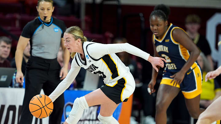 Iowa's Lucy Olsen (33) gets a loose ball during first half of the first round of the NCAA Women's college basketball game between Iowa and Murray State at the Llyod Noble Center in Norman, Okla., Saturday, March, 22, 2025.