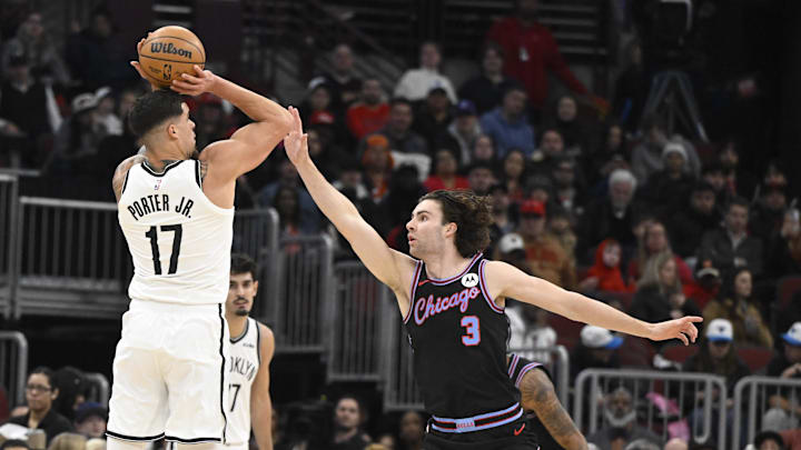Dec 3, 2025; Chicago, Illinois, USA;  Brooklyn Nets forward Michael Porter Jr. (17) shoots against Chicago Bulls guard Josh Giddey (3) during the first half at the United Center. Mandatory Credit: Matt Marton-Imagn Images