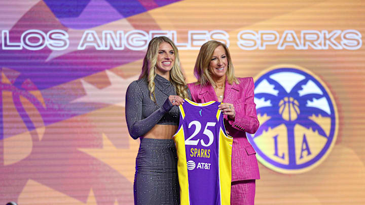 Apr 14, 2025; New York, New York, USA; Sarah Ashlee Barker poses with WNBA commissioner Cathy Engelbert after being selected with the number nine overall pick to the Los Angeles Sparks in the 2025 WNBA Draft at The Shed at Hudson Yards. Mandatory Credit: Vincent Carchietta-Imagn Images