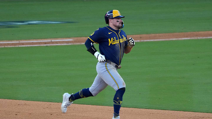 Oct 16, 2025; Los Angeles, California, USA; Milwaukee Brewers third baseman Caleb Durbin (21) runs the bases on a double in the seventh inning against the Los Angeles Dodgers during game three of the NLCS round for the 2025 MLB playoffs at Dodger Stadium. Mandatory Credit: Kirby Lee-Imagn Images