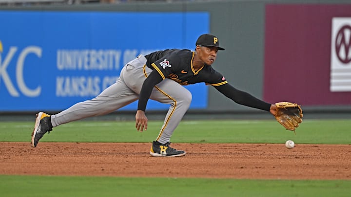 Jul 9, 2025; Kansas City, Missouri, USA;  Pittsburgh Pirates third baseman Ke'Bryan Hayes (13) dives for the ball in the fifth inning against the Kansas City Royals at Kauffman Stadium. Mandatory Credit: Peter Aiken-Imagn Images