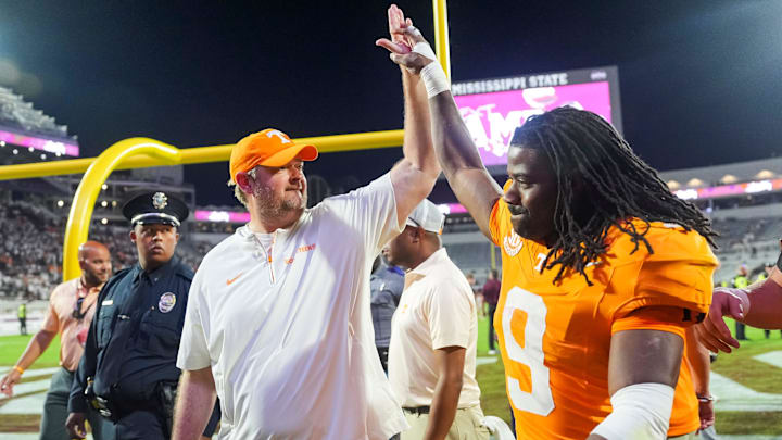 Tennessee coach Josh Heupel high fives Tennessee running back Star Thomas (9) after the Vols defeated Mississippi State in overtime at Davis Wade Stadium in Starkville, Miss., on Sept. 27, 2025.