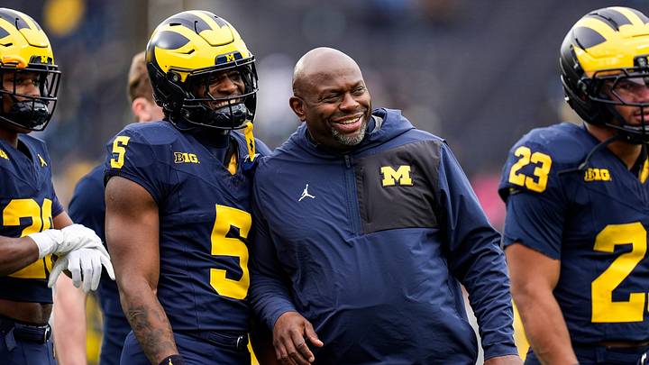 Michigan running backs coach Tony Alford, center, talks to running back Savion Hiter (5) before the spring game at Michigan Stadium in Ann Arbor on Saturday, April 18, 2026. Michigan running backs coach Tony Alford, center, talks to running back Savion Hiter (5) before the spring game at Michigan Stadium in Ann Arbor on Saturday, April 18, 2026.