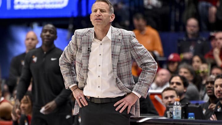Mar 15, 2025; Nashville, TN, USA;  Alabama Crimson Tide head coach Nate Oats watches his team against the Florida Gators during the first half at Bridgestone Arena. Mandatory Credit: Steve Roberts-Imagn Images