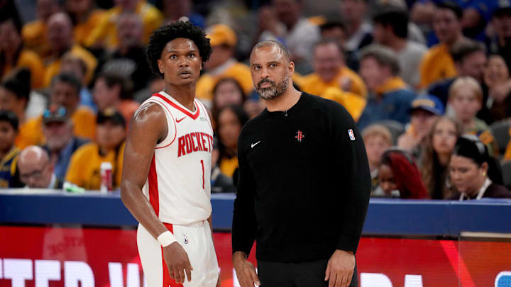 May 2, 2025; San Francisco, California, USA; Houston Rockets forward Amen Thompson (1) meets with Houston Rockets head coach Ime Udoka during a break in the action against the Golden State Warriors in the fourth quarter of game six of the first round for the 2025 NBA Playoffs at Chase Center. Mandatory Credit: Cary Edmondson-Imagn Images