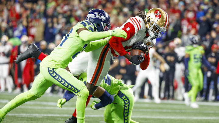 Nov 23, 2023; Seattle, Washington, USA; San Francisco 49ers wide receiver Brandon Aiyuk (11) catches a touchdown against the Seattle Seahawks during the fourth quarter at Lumen Field. Mandatory Credit: Joe Nicholson-USA TODAY Sports