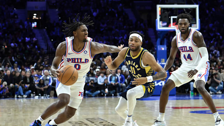 Nov 12, 2023; Philadelphia, Pennsylvania, USA; Philadelphia 76ers guard Tyrese Maxey (0) drives to the basket against Indiana Pacers forward Bruce Brown (11) during the fourth quarter at Wells Fargo Center. Mandatory Credit:  John Jones-Imagn Images