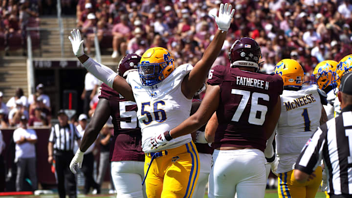 Sep 7, 2024; College Station, Texas, USA; McNeese State Cowboys defensive lineman Stephen Johnson (56) celebrates a play near Texas A&M Aggies offensive lineman Reuben Fatheree II (76) during the first quarter at Kyle Field. Mandatory Credit: Dustin Safranek-Imagn Images