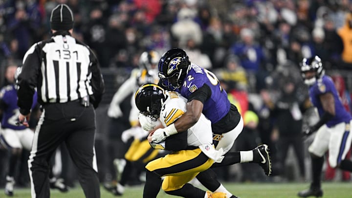 Jan 11, 2025; Baltimore, Maryland, USA; Baltimore Ravens defensive tackle Nnamdi Madubuike (92) tackles Pittsburgh Steelers quarterback Russell Wilson (3) in the third quarter in an AFC wild card game at M&T Bank Stadium. Mandatory Credit: Tommy Gilligan-Imagn Images