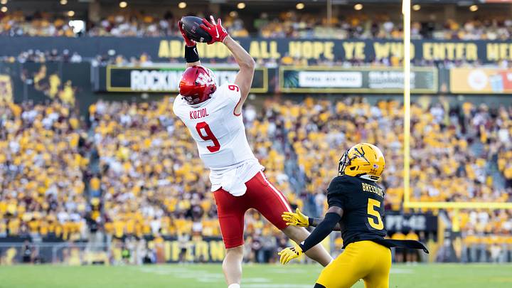 Oct 25, 2025; Tempe, Arizona, USA; Houston Cougars tight end Tanner Koziol (9) catches a pass against Arizona State Sun Devils safety Kyndrich Breedlove (5) in the first half at Mountain America Stadium. Mandatory Credit: Mark J. Rebilas-Imagn Images