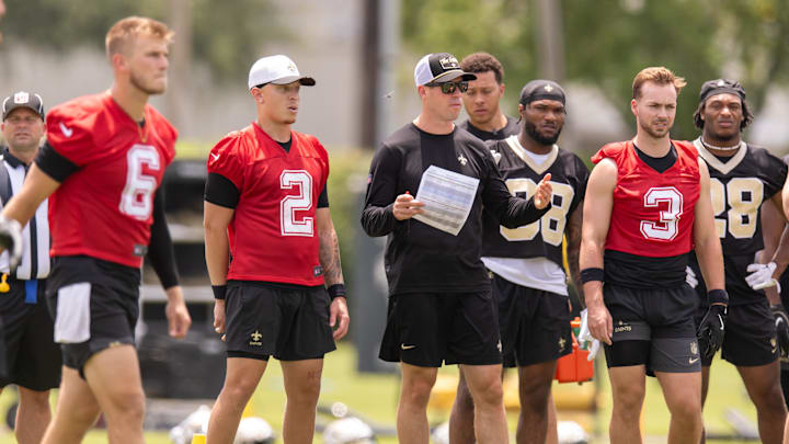 Jun 10, 2025; New Orleans, LA, USA;  New Orleans Saints quarterback Tyler Shough (6) and quarterback Spencer Rattler (2) and quarterback Jake Haener (3) look on during minicamp at Ochsner Sports Performance Center. Mandatory Credit: Stephen Lew-Imagn Images
