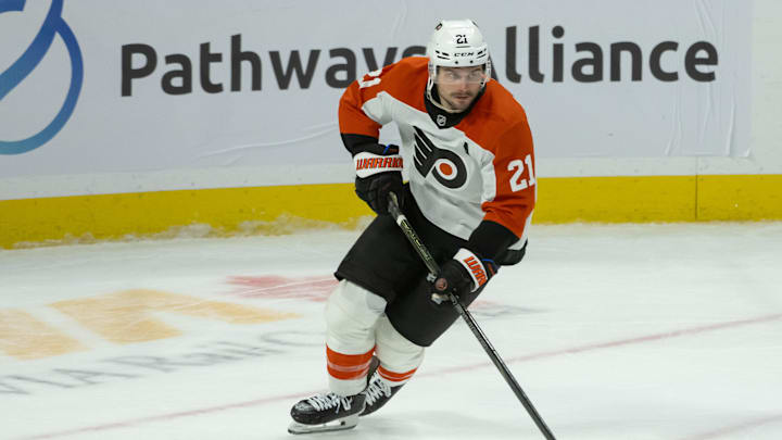 Nov 14, 2024; Ottawa, Ontario, CAN; Philadelphia Flyers center Scott Laughton (21) skates with the puck in overtime against the Ottawa Senators at the Canadian Tire Centre. Mandatory Credit: Marc DesRosiers-Imagn Images
