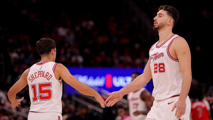Nov 12, 2025; Houston, Texas, USA; Houston Rockets guard Reed Sheppard (15) congratulates Houston Rockets center Alperen Sengun (28) during a timeout against the Washington Wizards during the fourth quarter at Toyota Center. Mandatory Credit: Erik Williams-Imagn Images