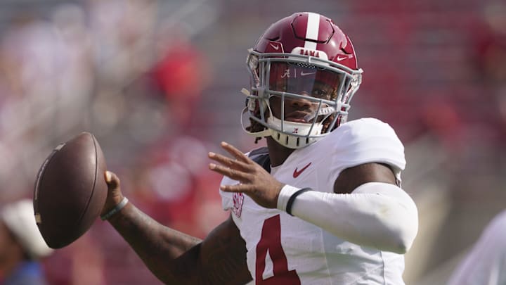 Sep 14, 2024; Madison, Wisconsin, USA;  Alabama Crimson Tide quarterback Jalen Milroe (4) throws a pass during warmups prior to the game against the Wisconsin Badgers at Camp Randall Stadium. Mandatory Credit: Jeff Hanisch-Imagn Images
